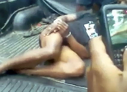 Torture of the captured Fiji fugitive being filmed on mobile phones. Image: Pacific Media Watch/Freeze frame from video