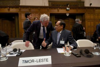 Photo: Australian lawyer Bernard Collaery (l) is calling for a judicial inquiry into the 2004 spying operation. (AFP: Nicolas Delaunay) Related Story: Australia rejects E Timor demands to return seized documents Map: Australia he Australian Government has warned East Timor there will be tough consequences over its decision to launch international arbitration proceedings over its maritime boundary with Australia. The warning, aiming to "send a message" to the Timorese leadership, was delivered through an intermediary in direct language by a highly placed Australian diplomat one week ago. The senior diplomat repeatedly warned the Timorese leadership they were being "naive to think the arbitration and maritime boundary issue would not